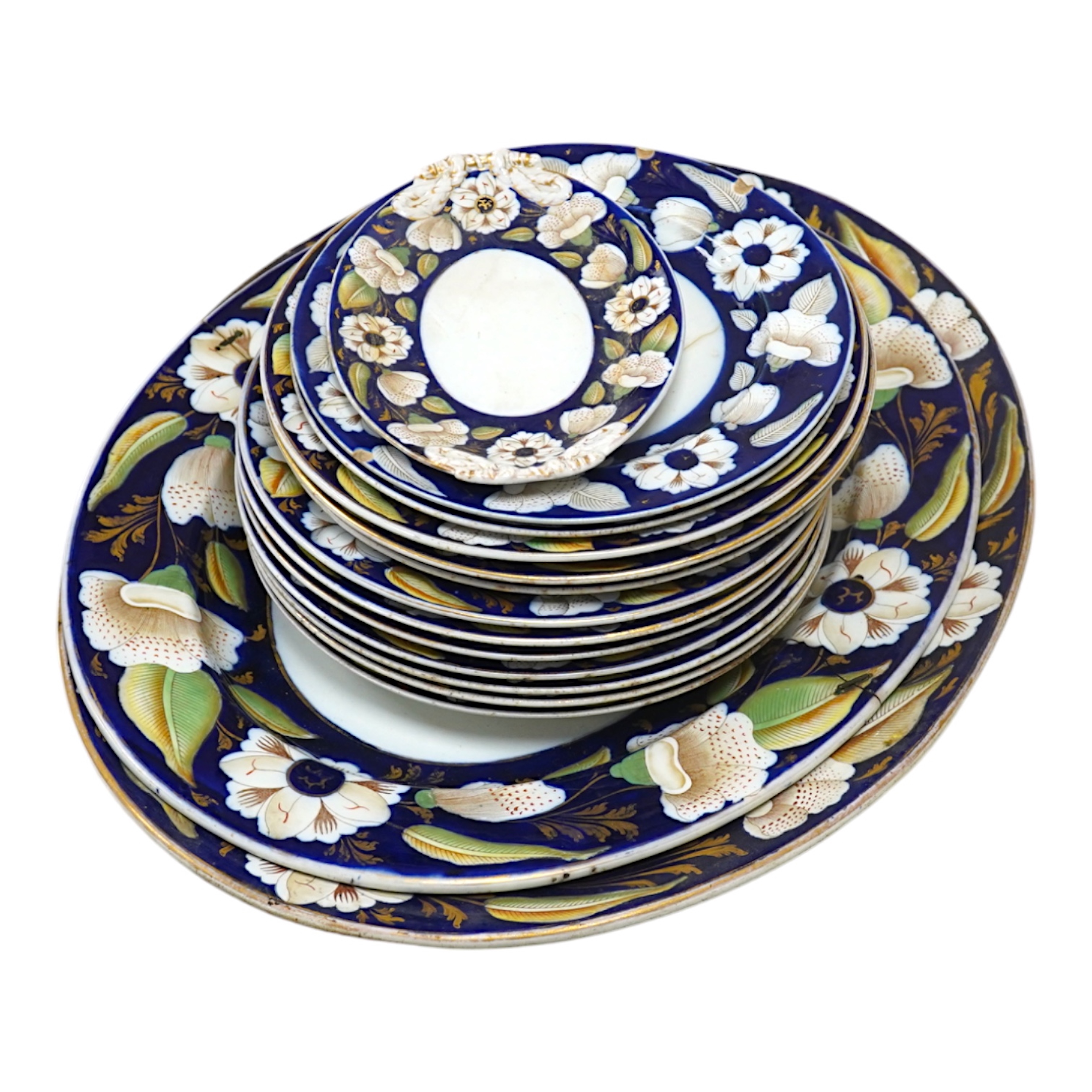 A Victorian Ironstone part set of floral decorated tableware. Condition - some items damaged